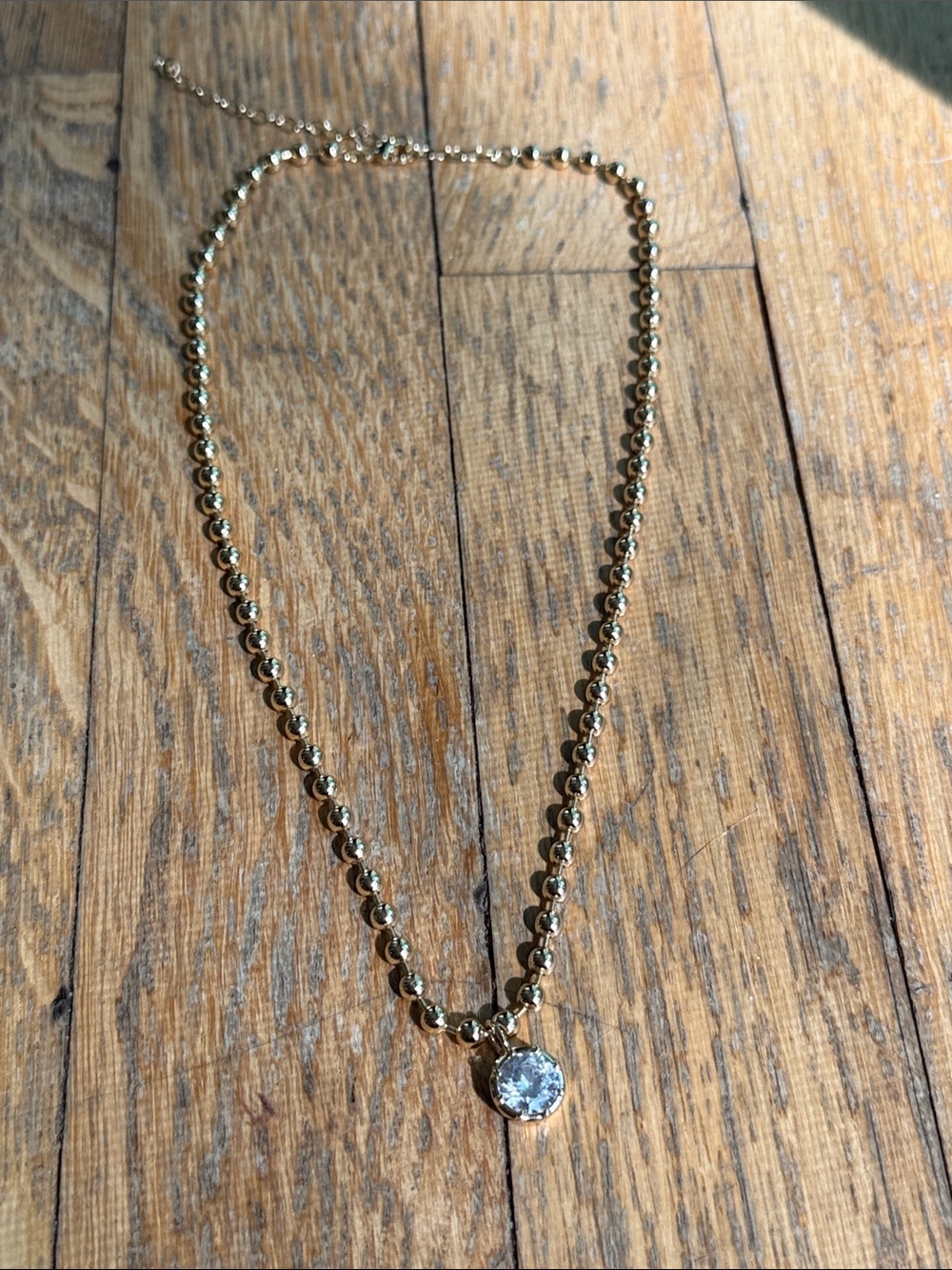 Lili Claspe Cleo gold Beaded Necklace with Clear Pendant
